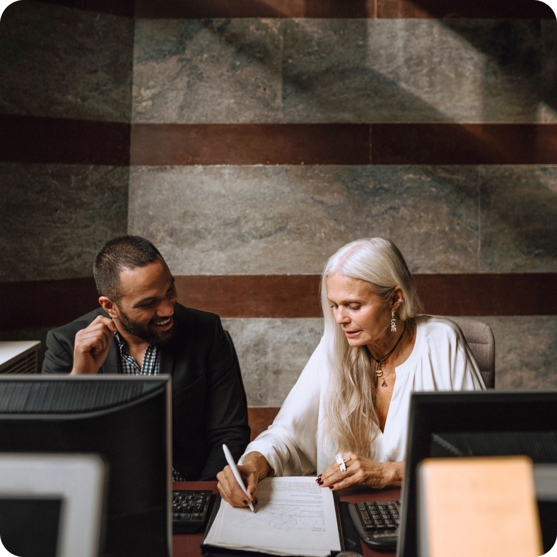 Two employees working on contract details