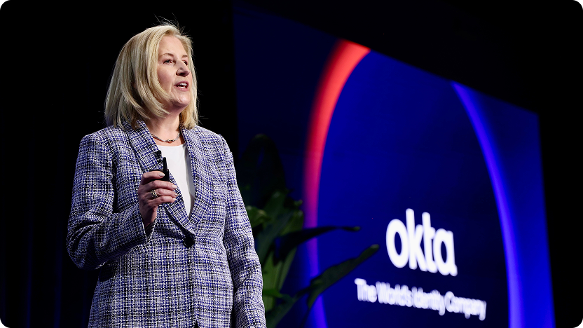 Amy Johanek in a blue tweed blazer delivering a presentation.