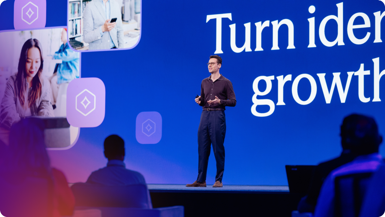 Gareth Davies, Chief Product Officer at Auth0 standing on stage presenting a keynote.