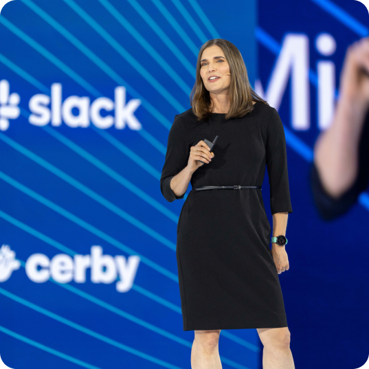 Woman speaking on stage at Oktane.