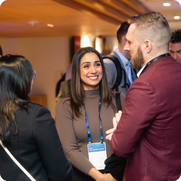 People talking in Okta Conference