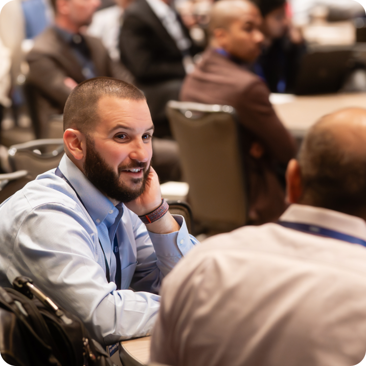 Professional networking at Okta conference.