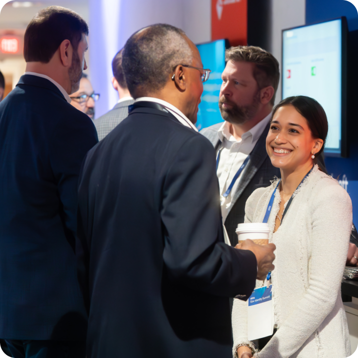 Business leaders in a Okta conference discussion.