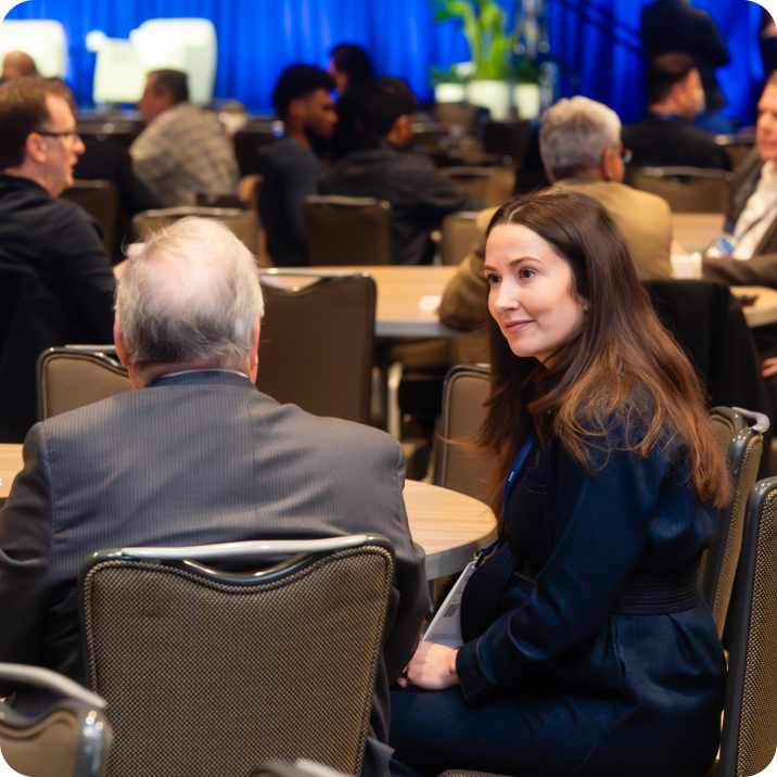 Professional networking at Okta conference.