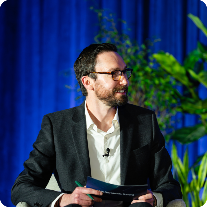 Man with beard and glasses speaking at the Gov Identity Summit