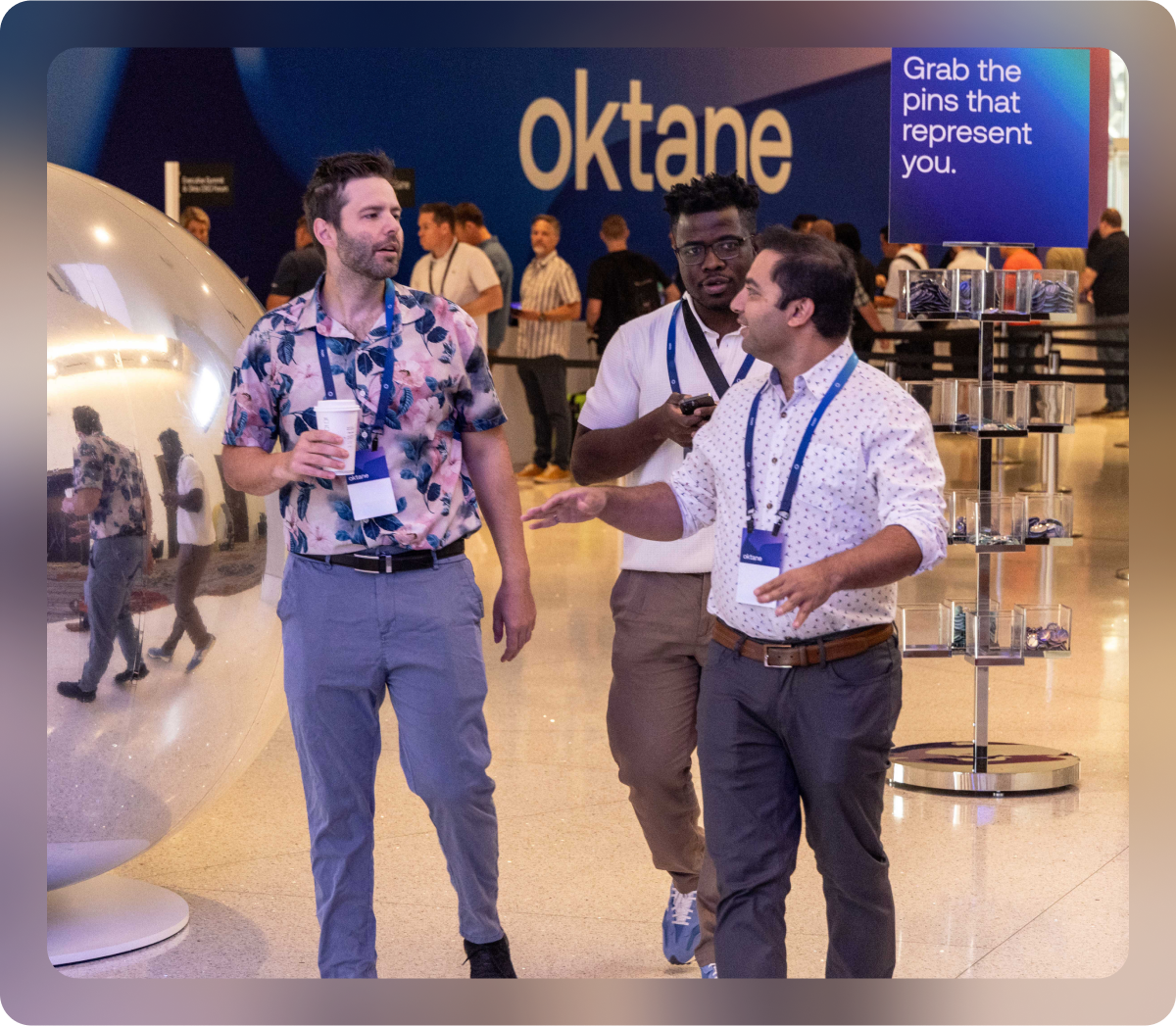 Three Okane attendees walking and chatting.