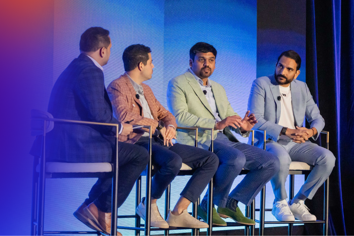 Four Speakers Sitting on Stage During Oktane Partner Summit Panel Discussion