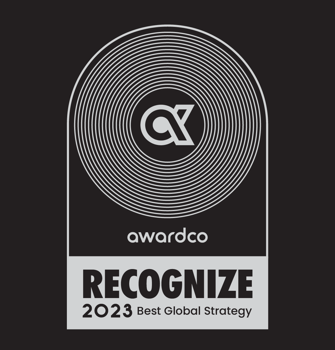 A monochromatic award plaque featuring the Awardco logo and the text 'Recognize 2023 Best Global Strategy.' 