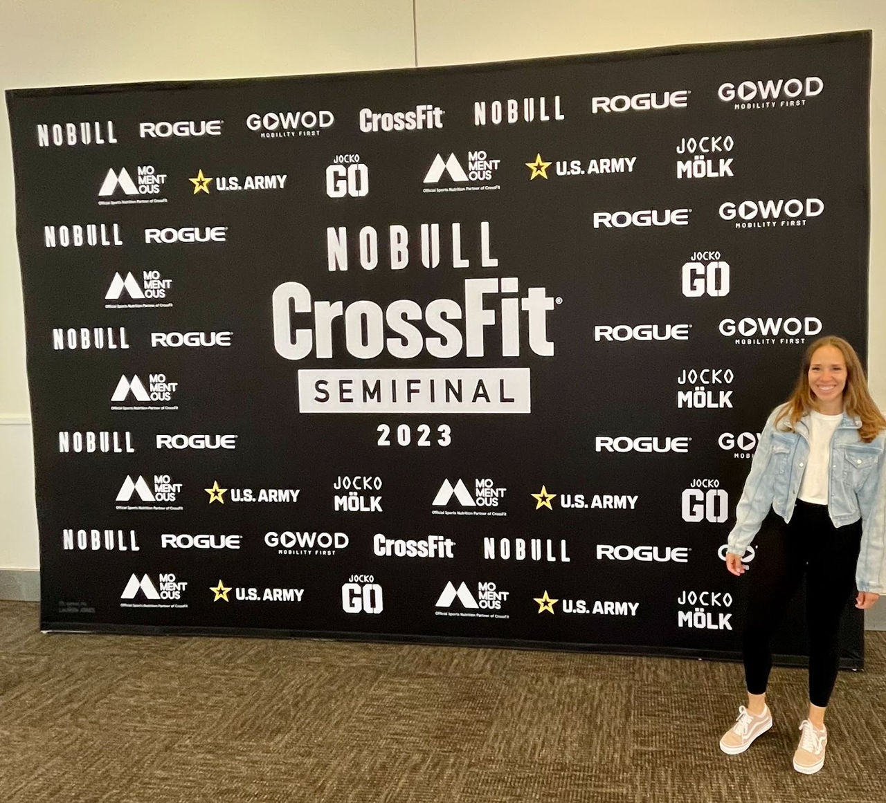A promotional backdrop for the CrossFit Semifinal 2023 event featuring multiple sponsor logos, including Nobull, Rogue, and U.S. Army. 