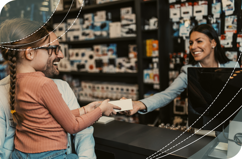 Father and daughter making a purchase at a retail store