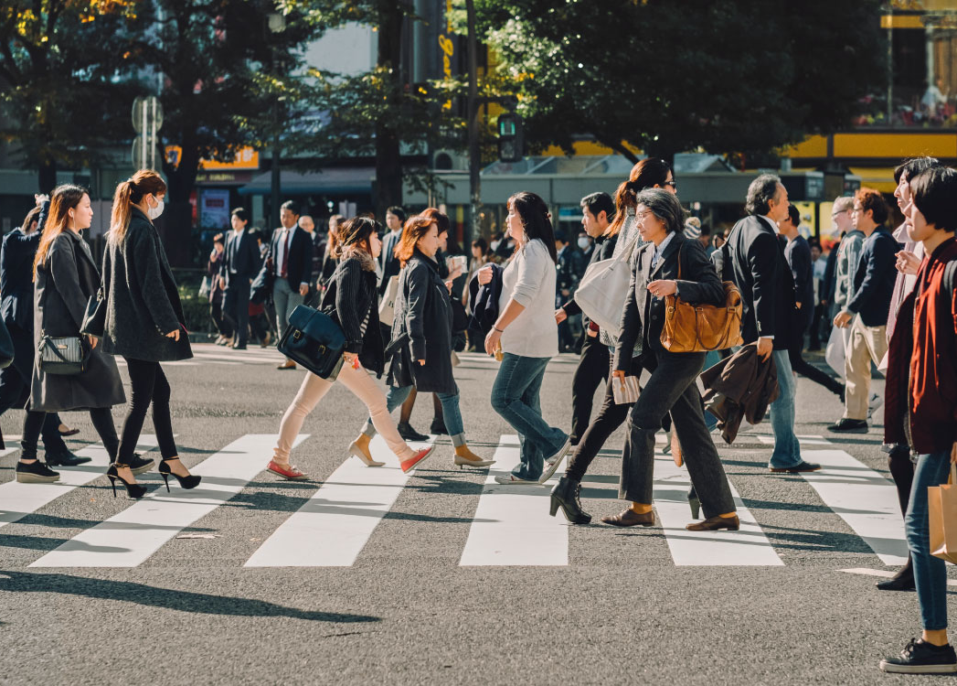 Pedestrians cross the road at a crossing