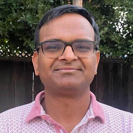 Raghu Pamidimarri smiling in his backyard