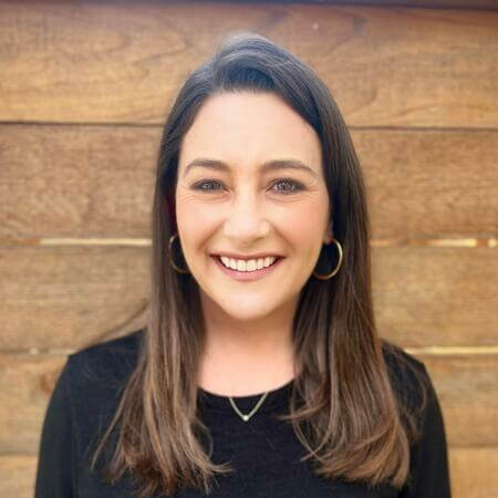 Erin Baudo Felter wearing a black shirt and smiling